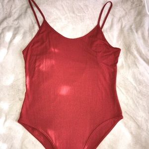 Orange/red body suit